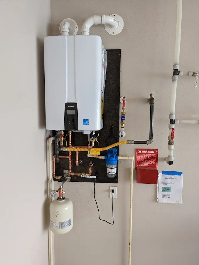 Professional plumber installing copper piping in a Garfield Heights home